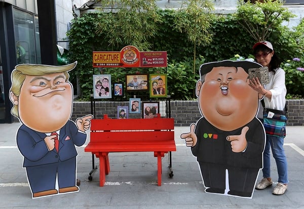 Caricatures depicting U.S. President Donald Trump, left, and North Korean leader Kim Jong Un are displayed in Seoul, South Korea, Sunday, May 26, 2019. In an apparent contradiction of his national security adviser, President Donald Trump on Sunday downplayed recent North Korean missile tests, tweeting from Tokyo that they're not a concern for him in comments sure to unnerve Japanese leaders. (Ahn Young-joon/AP)