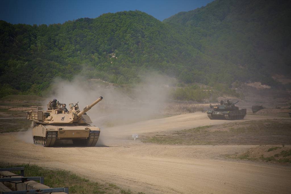 An M1A2 Abrams crew maneuvers to establish a support by fire position on May 9, 2019, at Rodriguez Live Fire Complex, Republic of Korea.