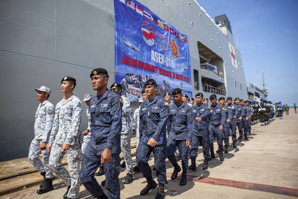 Singapore and Brunei Navy personnel march during the opening ceremony of the military non-combat exercise called ASEAN Solidarity Exercise at Batu Ampar Port on Batam island, Indonesia, Tuesday, Sept. 19, 2023.