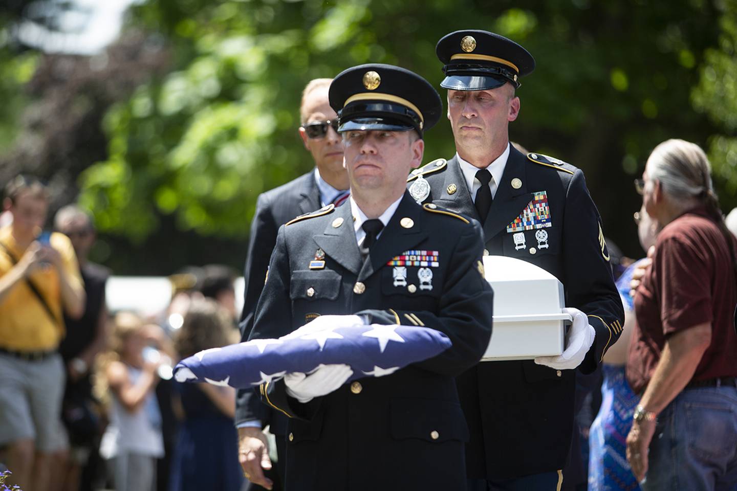 U.S. Army members carry a folded flag along with the remains of Vietnam War veteran Wayne Wilson during his memorial service at the Silverbrook Cemetery in Niles, Mich. on Wednesday, July 17, 2019