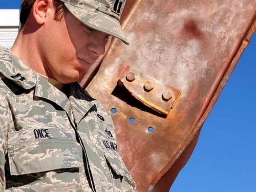 Captain Edward F. Dice, Jr., a member of AFSPC/A7X, holds the Purple Heart he was awarded Jan. 13 for injuries he sustained five years ago from a blast of an improvised explosive device while he was serving in Iraq.