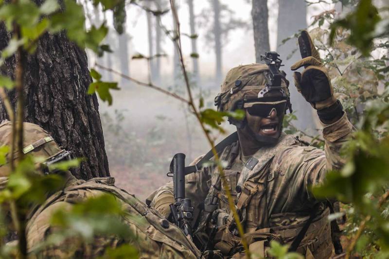 A combat engineer motions his team toward the breach point during the final live-fire exercise of rotation 21-01 on Oct. 27, 2020, at the Joint Readiness Training Center at Fort Polk, La.
