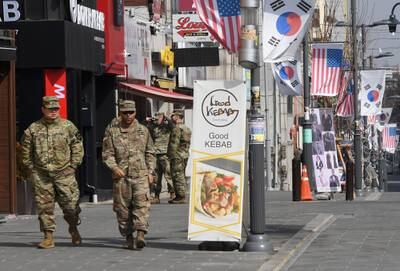 This picture taken Feb. 21, 2019, shows U.S. soldiers walking at a shopping zone outside Camp Humphreys in Pyeongtaek, South Korea.