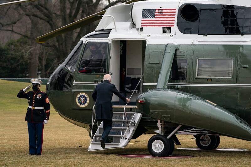 President Joe Biden boards Marine One to visit wounded troops at Walter Reed National Military Medical Center, on the South Lawn of the White House, Friday, Jan. 29, 2021, in Washington. (Evan Vucci/AP)
