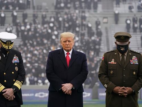 President Donald Trump (center) stands on the field before the 121st Army-Navy Football Game in Michie Stadium at the United States Military Academy in West Point, N.Y., on Dec. 12, 2020. (Andrew Harnik/AP)