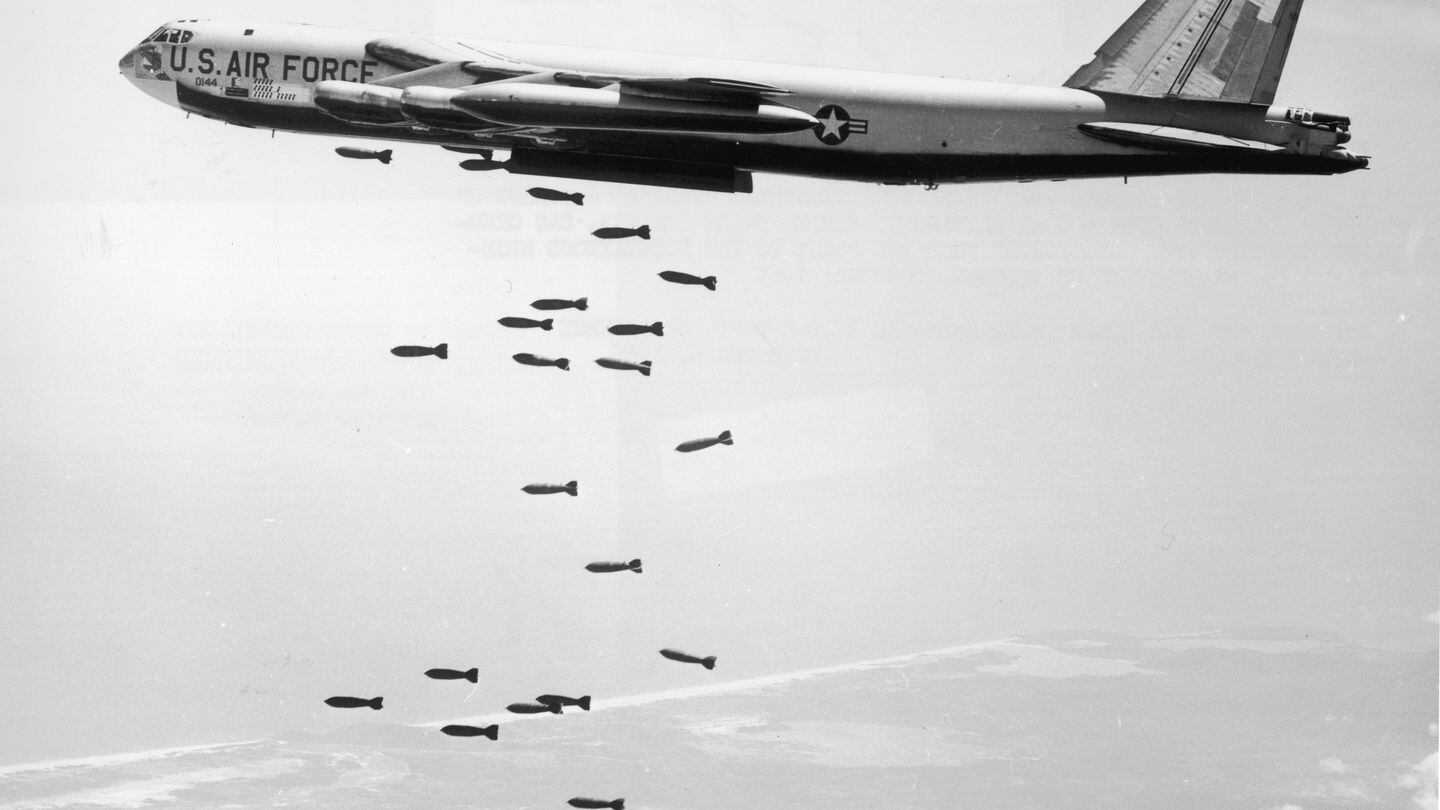 A U.S. Air Force B-52 drops a string of 750-pound bombs over a coastal target in Vietnam during the Vietnam War in October 1965. (U.S. Air Force via Getty Images)