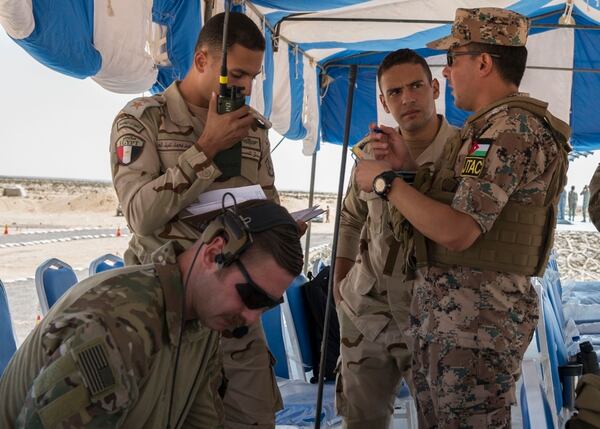 Egyptian paratroopers along with a American and Jordanian Joint Terminal Attack Controller call for close-air support from Egyptian F-16s during Bright Star 2018 at Talet El Kief, Egypt, in September 2018. (Sr. Amn. Amanda Stanford/Air Force)