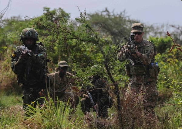 U.S. soldiers with the 2nd Brigade Combat Team, 101st Airborne Division run through squad battle drills with a member of the Rwanda Defence Force during Exercise Shared Accord in Gabiro, Rwanda on Aug. 20, 2019. (Sgt. Heather Doppke/Army)