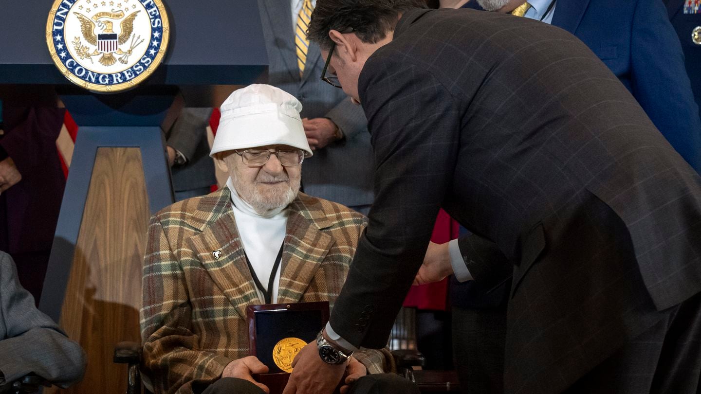 House Speaker Mike Johnson, R-La., right, presents Ghost Army member Bernard Bluestein, of Hoffman Estates, Ill., with a medal during a ceremony to honor members of the secretive WWII-era unit with the Congressional Gold Medal during a ceremony on Capitol Hill, Thursday, March 21, 2024, in Washington. (Mark Schiefelbein/AP)