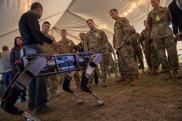 Jiren Parikh, Ghost Robotics CEO, briefs service members on the capabilities of the Robodogs during the Advanced Battle Management System demonstration at Eglin Air Force Base, Fla., on Dec. 18, 2019. (Tech. Sgt. Joshua J. Garcia/U.S. Air Force)