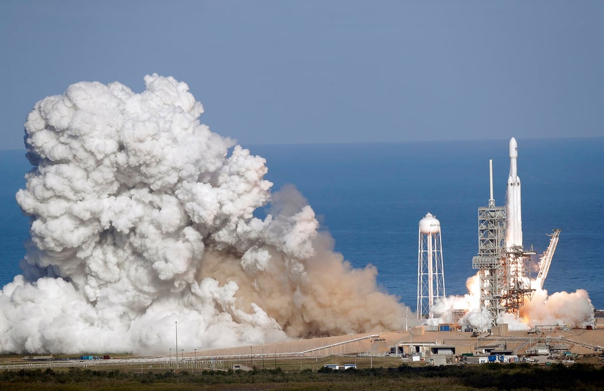 Spacex S Big New Rocket Blasts Off Puts Sports Car In Space