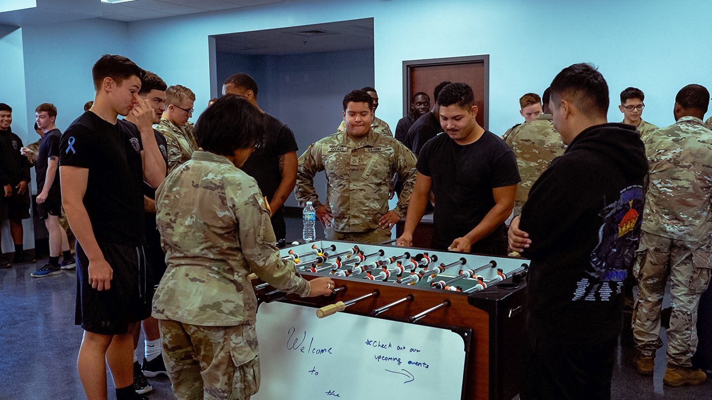 Soldiers play foosball in the new BOSS Center on Camp Bull Simons, Fla. Oct. 14, 2022. The Better Opportunities for Single Soldiers program supports overall quality of life, morale and readiness. (Spc. Taylor Zacherl/Army)