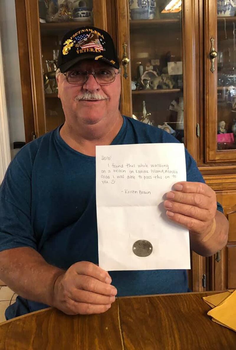 Terry Richerson holds up a letter with his father's dog tag that was found by a woman in Kodiak, Alaska. (Photo courtesy of Dawn Johnson)