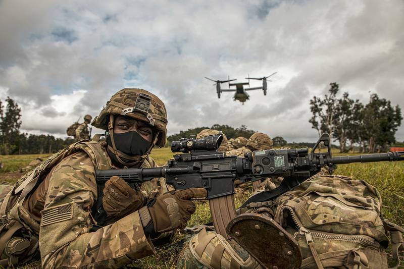 A service member participates in an exercise called Operation Wardog Kila for a joint live-fire exercise at Schofield Barracks, Hawaii, Dec. 30, 2020, with the 25th Combat Aviation Brigade, 25th Infantry Division Artillery units and the U.S. Marine Corps.