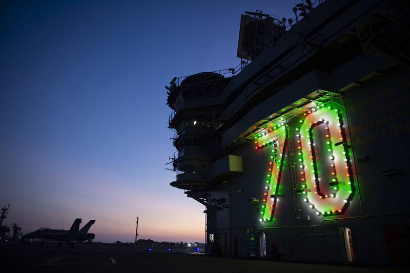 The Nimitz-class nuclear aircraft carrier USS Carl Vinson (CVN 70) displays holiday lights on the island in celebration of the holiday season on Nov. 26, 2020, in San Diego.