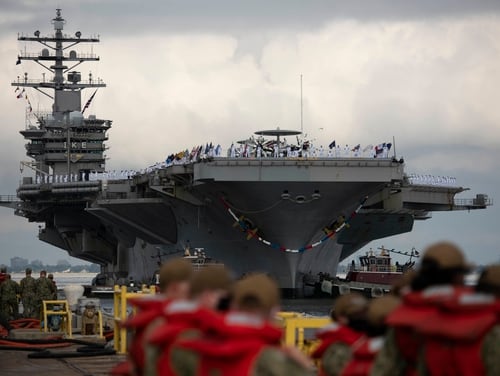 The carrier Dwight D. Eisenhower returns to Naval Station Norfolk after a Middle East deployment. (U.S. Navy)