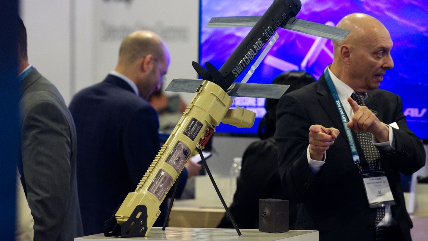 A man points toward a Switchblade 300 Block 20 loitering munition, made by AeroVironment. The U.S. has sent Switchblade drones to Ukraine. (Colin Demarest/C4ISRNET)