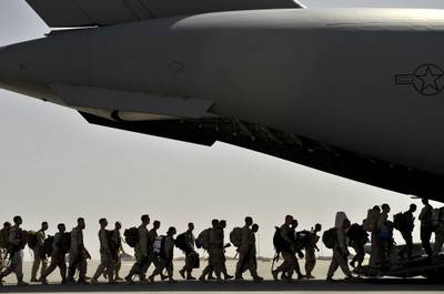 Marines board an Air Force C-17 Globemaster III during a redeployment mission at Camp Bastion Airfield, Afghanistan, Sept. 11, 2012.