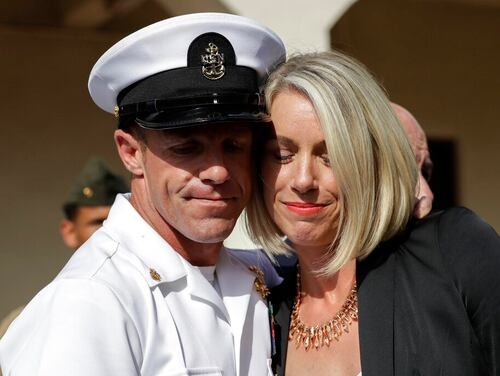 Special Warfare Operator Chief Edward “Eddie” Gallagher and his wife Andrea hug after leaving the Naval Base San Diego courthouse in July. (Gregory Bull/AP)