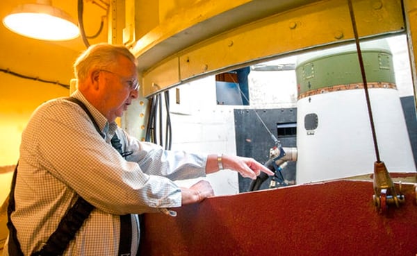 In this Sept. 27, 2017 photo, Bob Hicks stands in the equipment room that encircles the launch tube and unarmed missile in the Delta-09 silo, which is part of the Minuteman Missile National Historic Site near Wall, S.D. The silo looks much the same as a former one near Vale that Hicks entered in 1964 while responding to an accident. (Hannah Hunsinger/Rapid City Journal via AP)