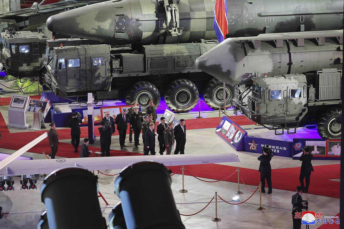 In this photo provided by the North Korean government, North Korean leader Kim Jong Un, center right, and Russian Defense Minister Sergei Shoigu, front left, visit an arms exhibition in Pyongyang, North Korea Wednesday, July 26, 2023.