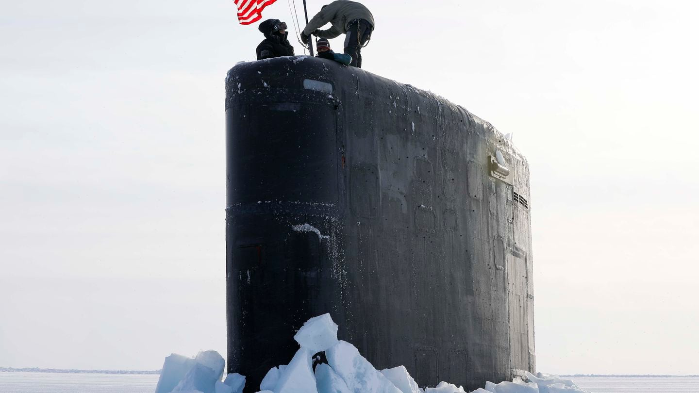 Sailors assigned to the Los Angeles-class attack submarine USS Hampton (SSN 767) raise the national ensign at Ice Camp Whale on the Arctic Ocean, on March 8 during Operation Ice Camp 2024. (MC1 Justin Yarborough/US Navy)
