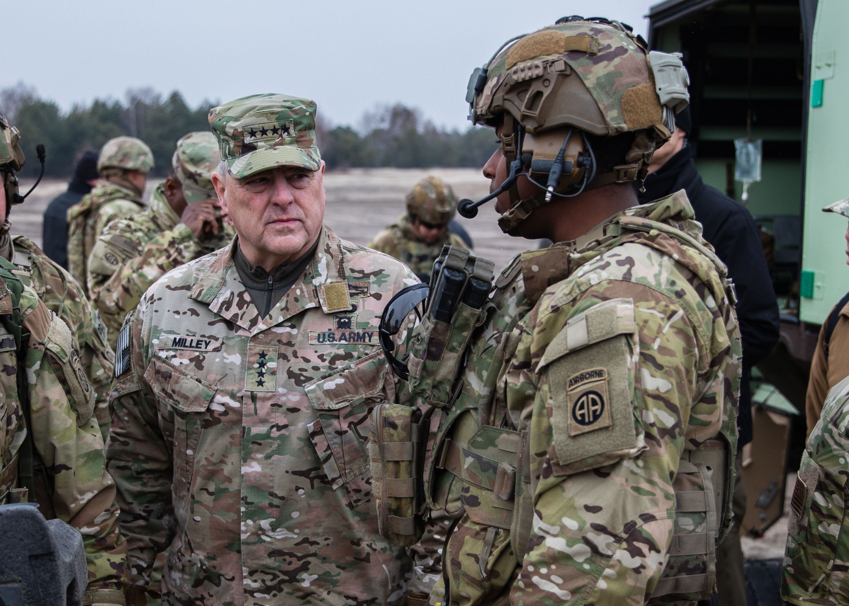 Gen. Mark Milley, chairman of the Joint Chiefs of Staff, speaks with a paratrooper assigned to the 82nd Airborne Division during a visit to Nowa Deba, Poland, March 4, 2022. (Master Sgt. Alexander Burnett/Army)