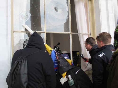 Rioters enter the Capitol building through a smashed window on Jan. 6, 2021. (Kyle Rempfer/Staff)