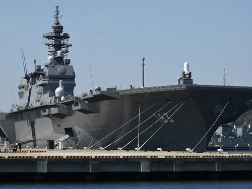 Japan Maritime Self Defense Forces’ latest helicopter destroyer Izumo anchors at its Yokosuka base in Yokosuka on March 31, 2015. The JS Izumo (DDH-183), with a length of 248-meters and displacing 19,500 tons, is the largest vessel procured by the MSDF ever. (Toshifumi Kitamura/AFP)