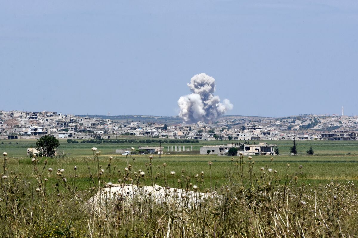 Smoke billows from the town of Habeet after shelling by Syrian army forces from the adjacent town of Kafr Nabuda on May 11, 2019.