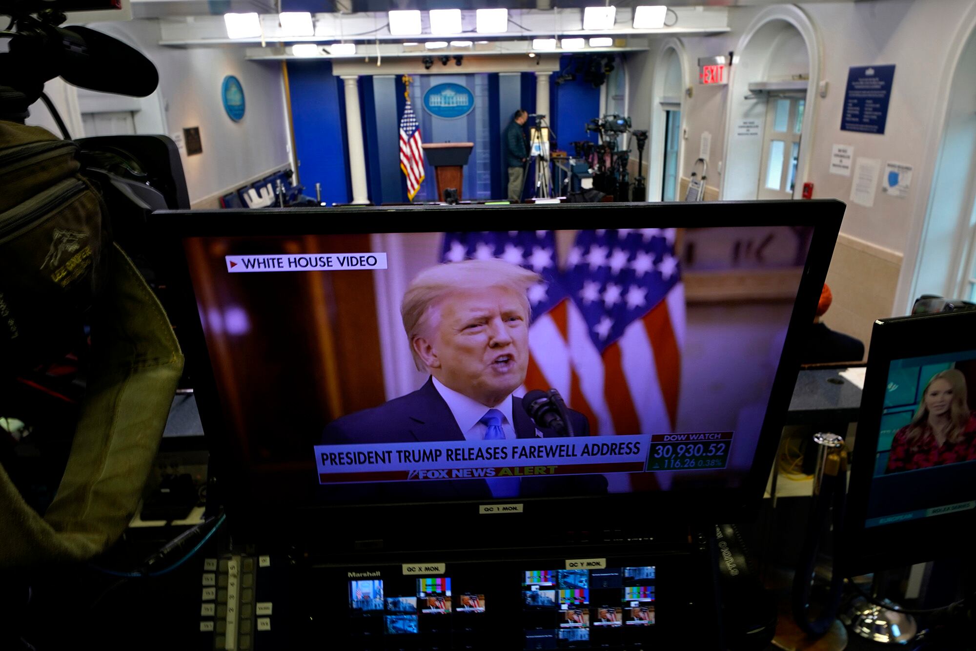 President Trump is seen on a network monitor after his pre-recorded farewell speech was released, inside the Brady Press Briefing Room at the White House, Tuesday, Jan. 19, 2021, in Washington.