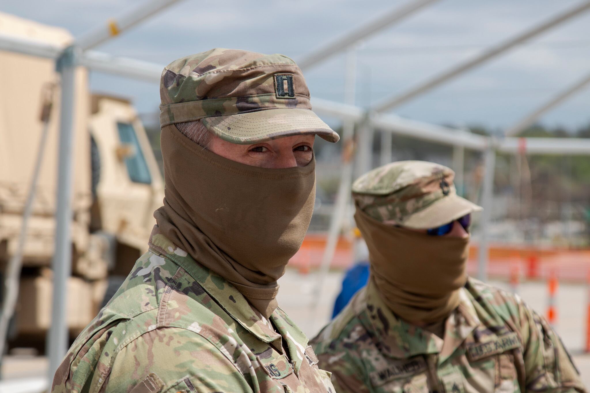 Capt. Eric Siemens visits his soldiers at the first drive-through testing site for COVID-19 in Des Moines, Iowa.