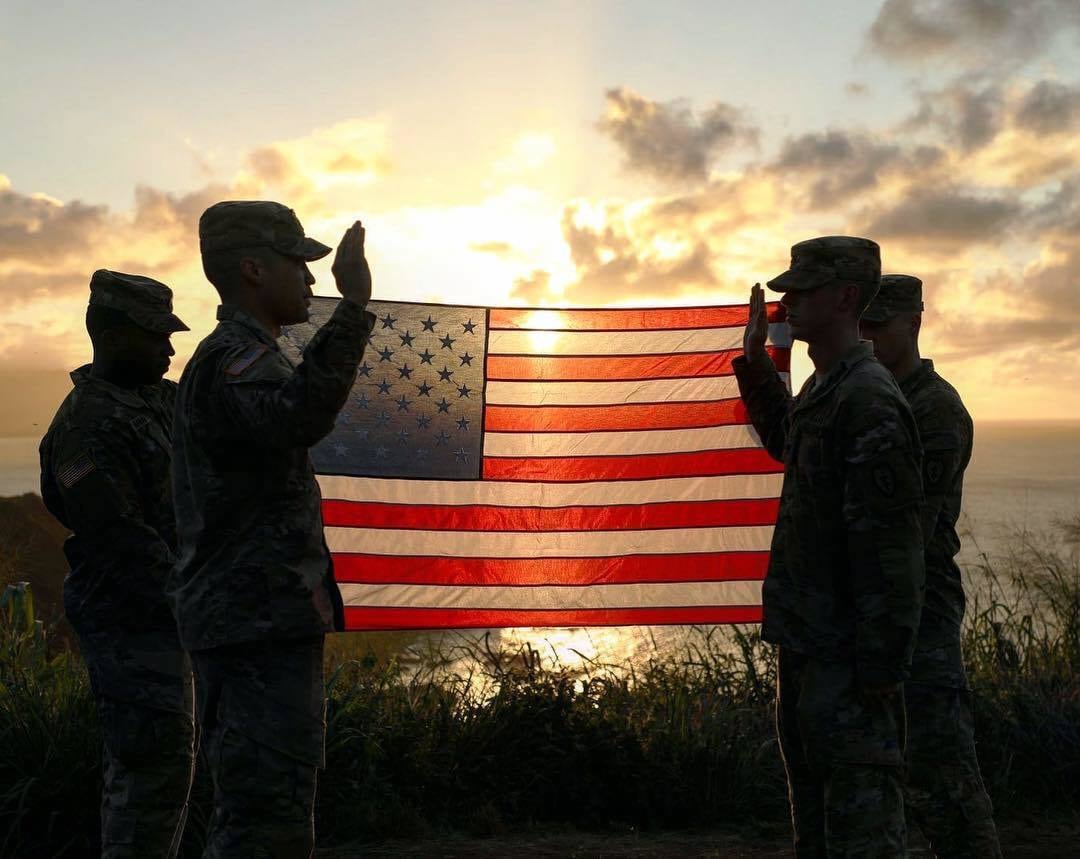 A soldier reenlists along the Pupukea summit over the island of Oahu, Hawaii, Sept. 8, 2019.