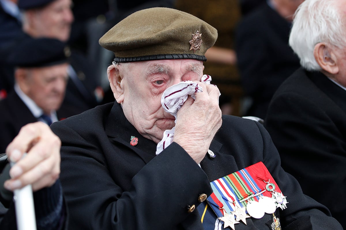 A veteran wipes his eyes during a ceremony to mark the 75th anniversary of D-Day