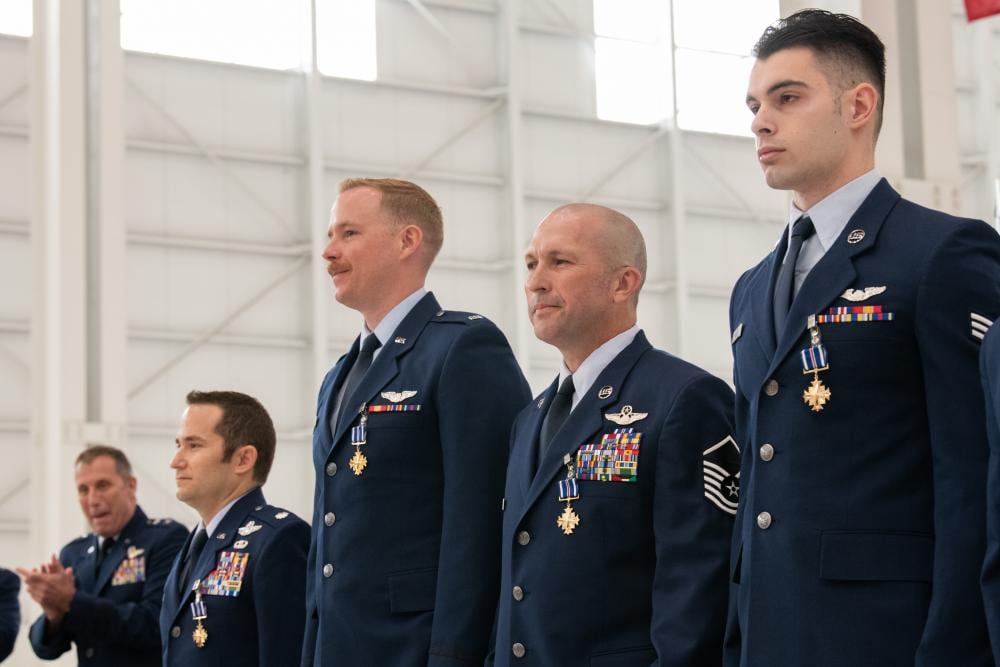 Air Force Reserve Command deputy commander Maj. Gen. Matthew J. Burger, the former boss of the 349th Air Mobility Wing, awards the Distinguished Flying Cross to four C-17A Globemaster III aircrew members during a ceremony at Travis Air Force Base, Calif., Apr. 1, 2022. Burger presented the medals to Lt. Col. Dominic Calderon, 1st Lt. Kyle Anderson and Master Sgt. Silva Foster from the 301st Airlift Squadron, and Senior Airman Michael Geller of the 517th Airlift Squadron (L-R). (Grant Okubo/Air Force)