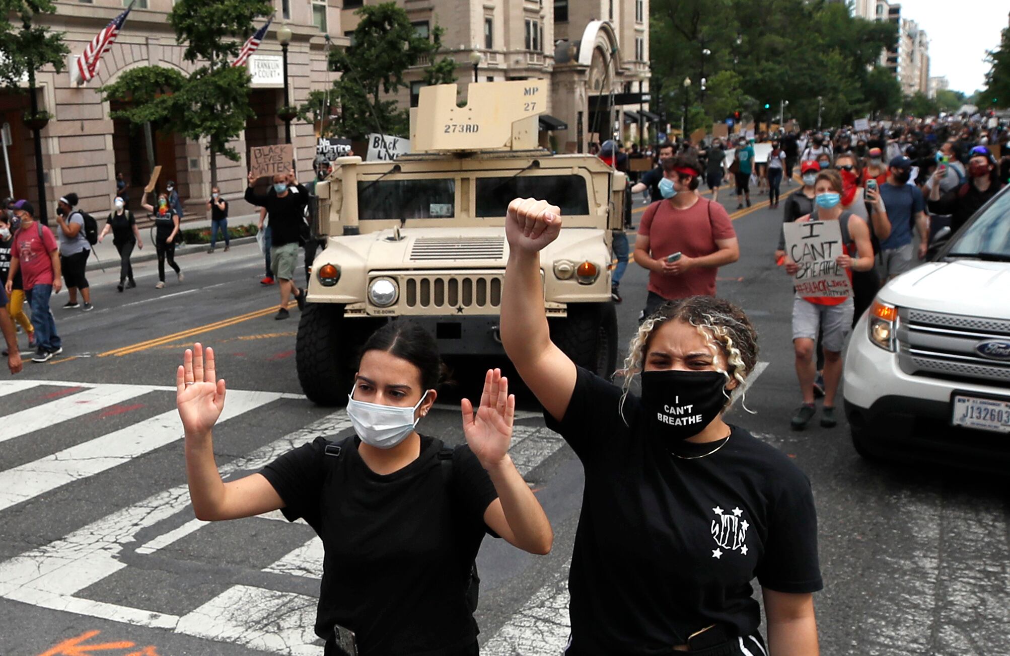 Demonstrators march as they protest the death of George Floyd, Tuesday, June 2, 2020, in Washington.
