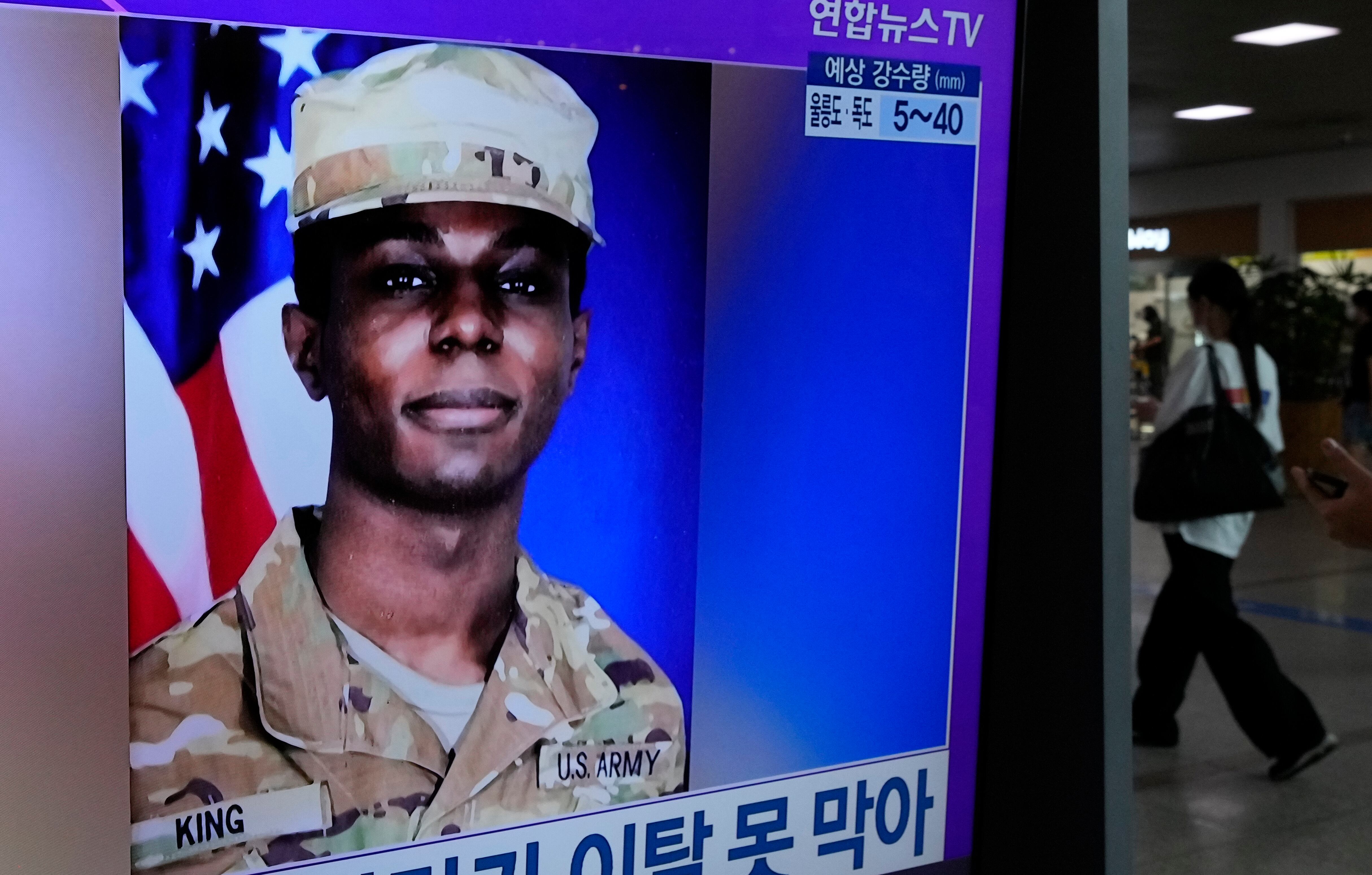 A TV screen shows a file image of American soldier Travis King during a news program at the Seoul Railway Station in Seoul, South Korea, Monday, July 24, 2023.