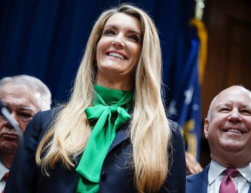 Kelly Loeffler smiles while being introduced by Georgia Gov. Brian Kemp as his pick to fill Georgia's vacant U.S. Senate seat on Dec. 4, 2019, in Atlanta, Ga. (Elijah Nouvelage/AP)