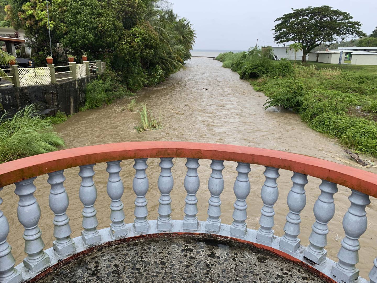 The Laelae River in Umatac, Guam, becomes swollen with the addition of rain runoff resulting from increased shower activity as Typhoon Mawar approaches the region on May 23, 2023.