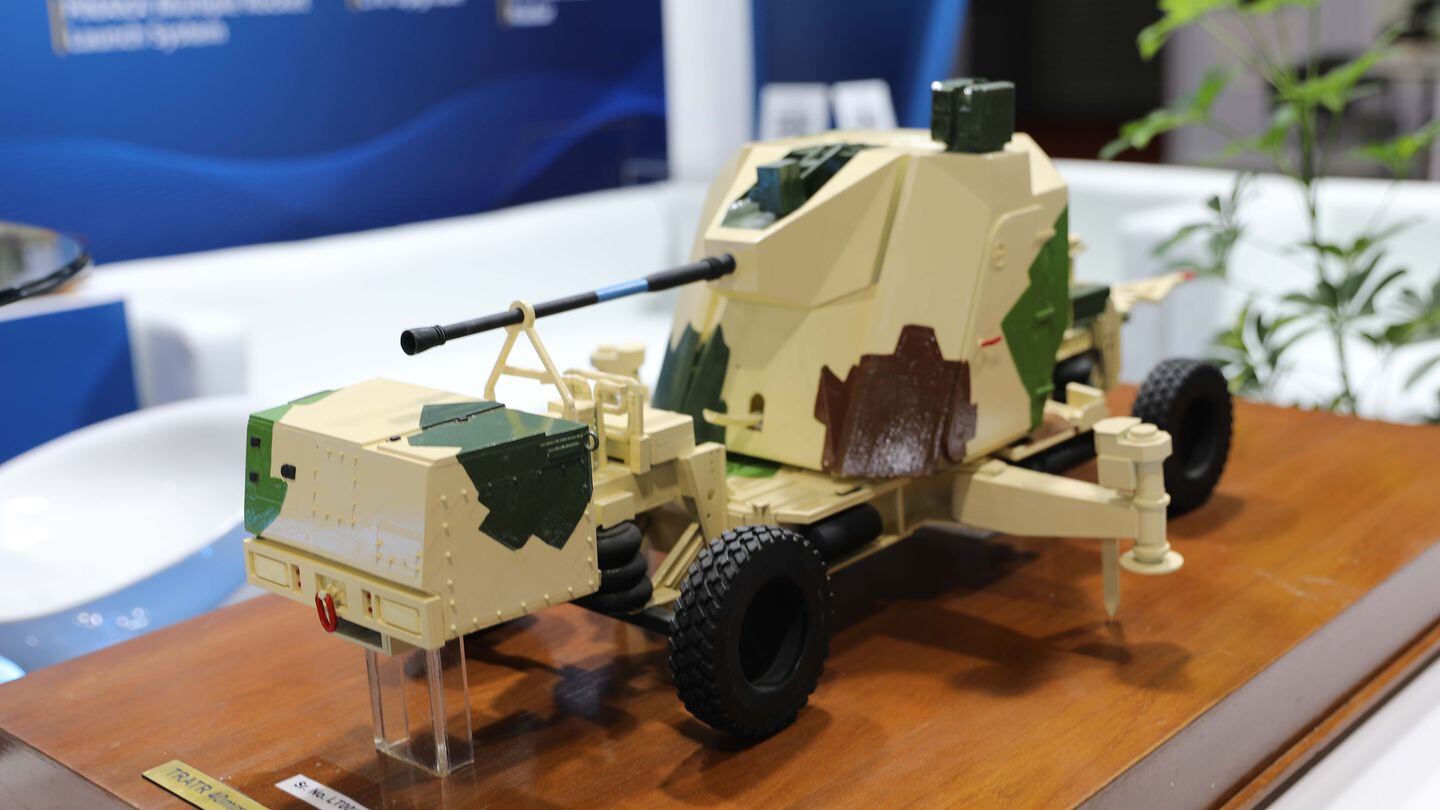 A scale model depicts a 40mm towed gun used on the Sudarshan air defense system, as developed by Larsen & Toubro in India. (Gordon Arthur/Staff)
