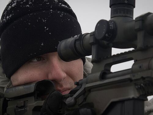 Sgt. Conrado Hoyos, a sniper assigned to Headquarters and Headquarters’ Troop sniper section, 3rd Squadron, 2nd Cavalry Regiment, peers through the scope of his M2010 rifle as he acquires his target at a range near the Bemowo Piskie Training Area, Poland. (U.S. Army photo by Spc. Andrew McNeil)