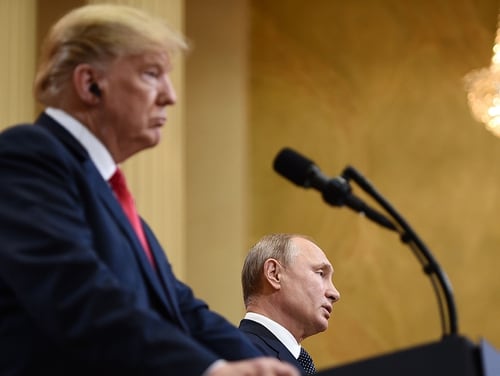 US President Donald Trump and Russia's President Vladimir Putin attend a joint news conference after a meeting at the Presidential Palace in Helsinki on July 16, 2018. (Brendan Smialowski/AFP via Getty Images)