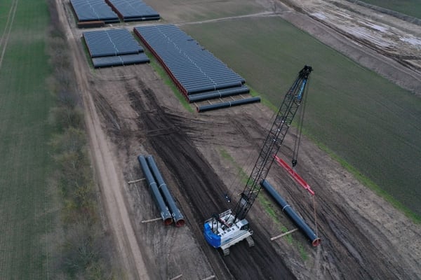 Sections of pipe lie at a pipe depot for construction of the Eugal gas pipeline on March 26, 2019, near Wrangelsburg, Germany. The pipeline is meant to transport natural gas arriving from Russia through the Nord Stream 2 pipeline. (Sean Gallup/Getty Images)