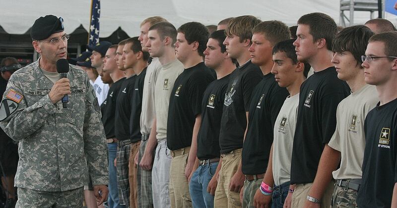 Then-Brig. Gen. Jeffrey E. Phillips takes part in an enlistment ceremony in Oshkosh, Wis., in 2009. Phillips, now a member of Mission: Readiness, says youth fitness issues are critical to the strength of the future force. (Army)