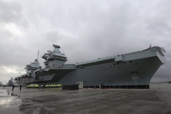 Police officers are seen in front of the HMS Queen Elizabeth during its commissioning ceremony on Dec. 7, 2017, in Portsmouth, England. (Matt Cardy/Getty Images)