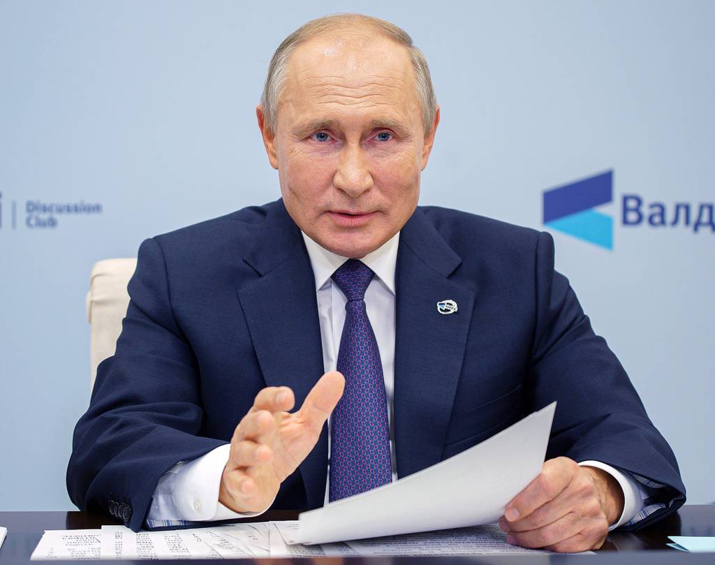Russian President Vladimir Putin speaks as he participates in the annual meeting of the Valdai Discussion Club via video conference at the Novo-Ogaryovo residence outside Moscow on Oct. 22, 2020.