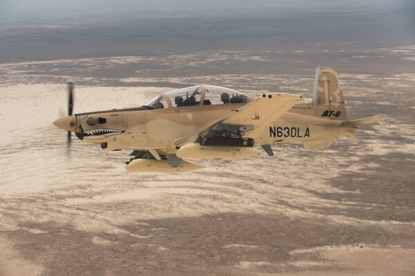 A Beechcraft AT-6 experimental aircraft flies over White Sands Missile Range. The AT-6 is participating in the U.S. Air Force Light Attack Experiment (OA-X), a series of trials to determine the feasibility of using light aircraft in attack roles. (Ethan D. Wagner/U.S. Air Force)