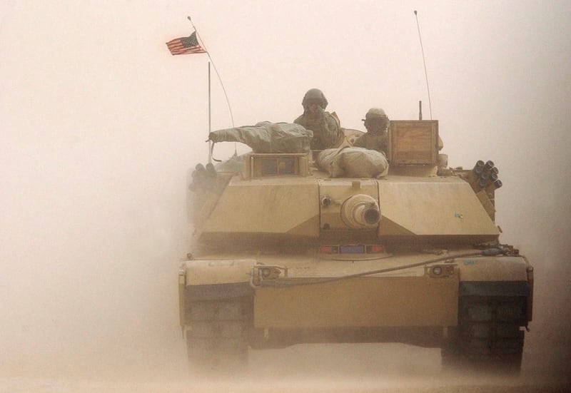 A U.S. Marine Corps M1/A1 Abrahms tank rolls on despite a blinding sand storm during exercises February 3, 2003 near the Iraqi border in Kuwait. (Scott Nelson/Getty Images)