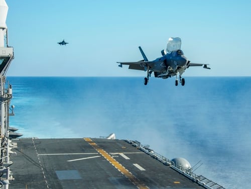 U.S. Marine Corps F-35B Lightning IIs with Marine Medium Tiltrotor Squadron 164 (Reinforced), 15th Marine Expeditionary Unit prepare to land on the flight deck of the amphibious assault ship USS Makin Island (LHD 8). The F-35Bs provide close air support to Operation OCTAVE QUARTZ. (U.S. Marine Corps photo by Cpl. Patrick Crosley)