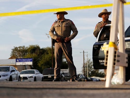 Law enforcement officials work the scene of a shooting at the First Baptist Church of Sutherland Springs, Monday, Nov. 6, 2017, in Sutherland Springs, Texas. (Eric Gay/AP)